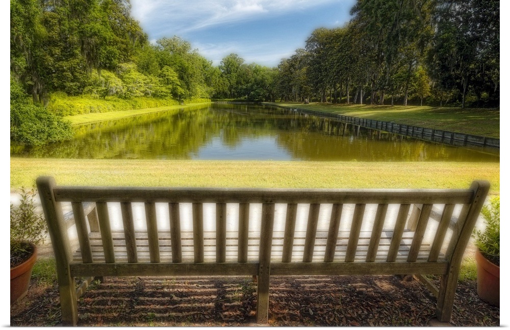 A photograph of a bench looking out to a pond in South Carolina.