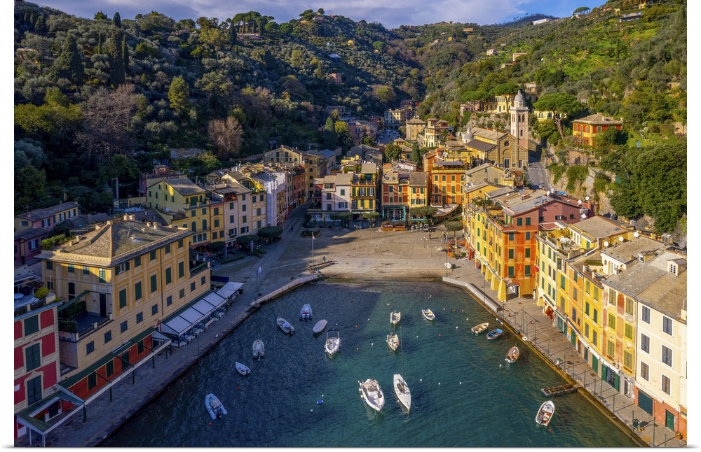 Portofino is a fishing village on the Ligurian Riviera near the city of Genoa. Pastel-colored houses overlook the Piazzett...