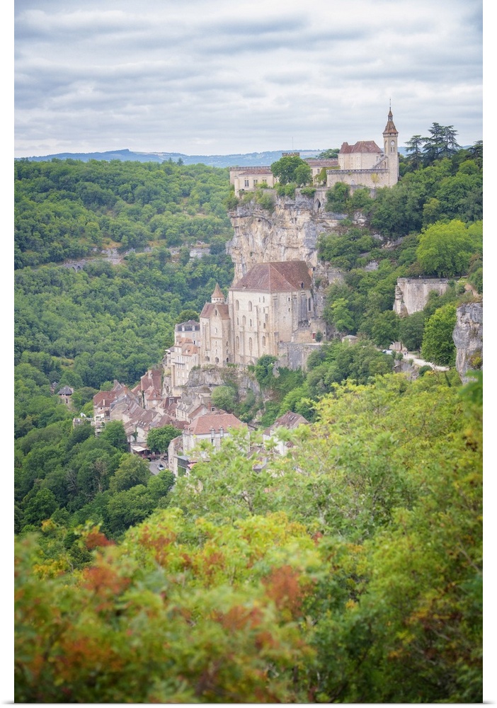 Verical view of Rocamadour old medieval village in the south of France, occitanue area, among trees in the middle of a gre...