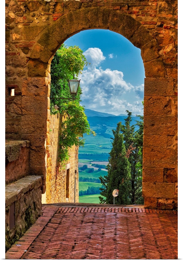 Arch with the view of the Tuscan countryside, Pienza, Tuscany, Italy.