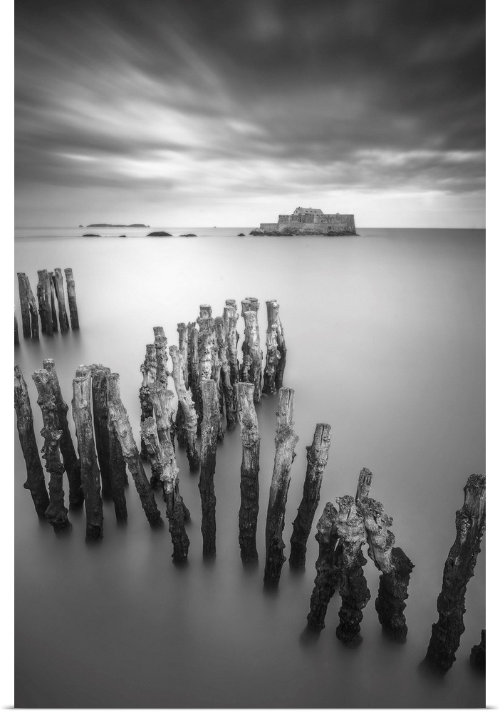 Black and white vertical long time exposure view of the shorecoast of Saint Malo in Brittany, a view at high tide of the F...