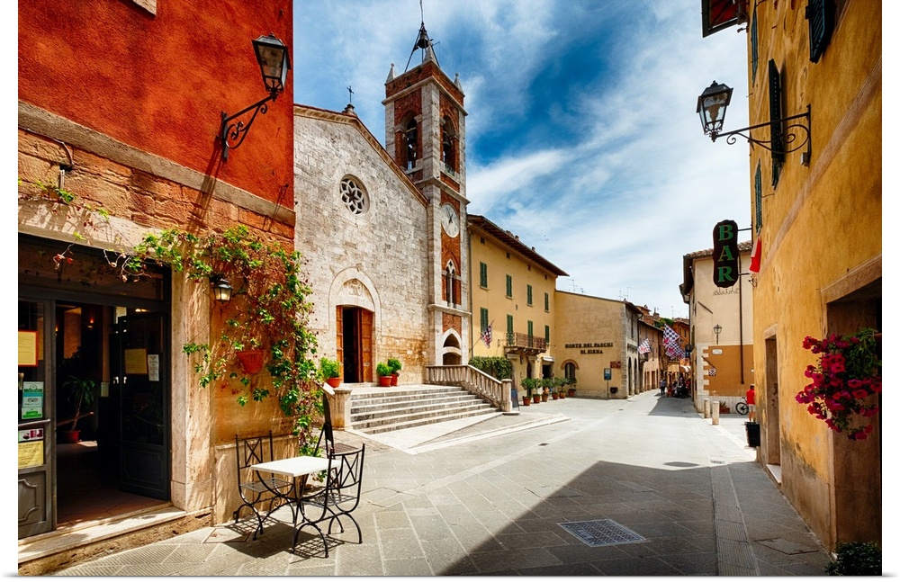 Street with a Catholic Church, San Quirico, Tuscany, Italy.