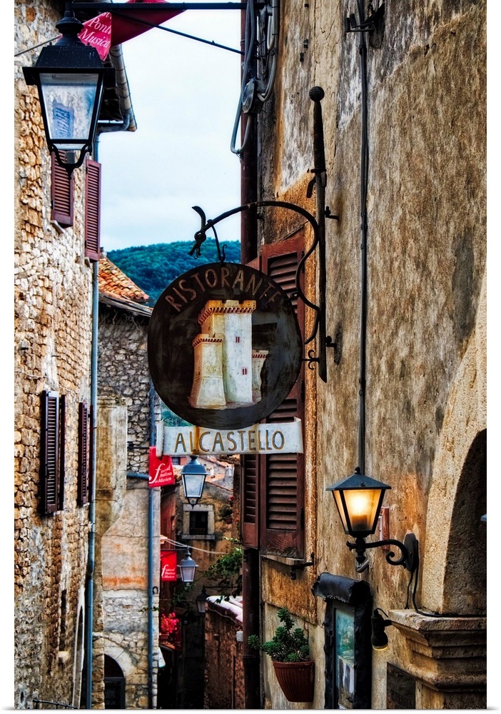 Narrow Medieval street with signs and lamps, Sermoneta,Latina,  Italy.
