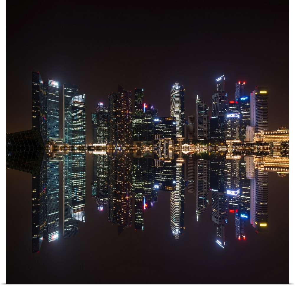 Fine art photograph of the Singapore skyline reflected in the bay at night.