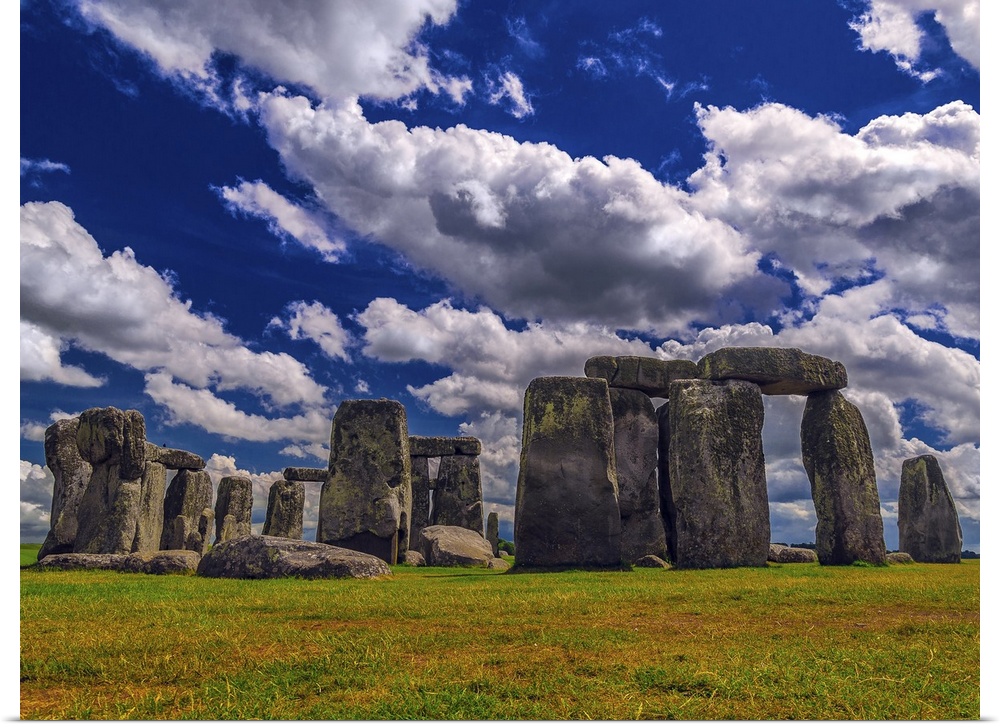 England's Stonehenge site rests under magnificent billowing clouds and deep blue skies.