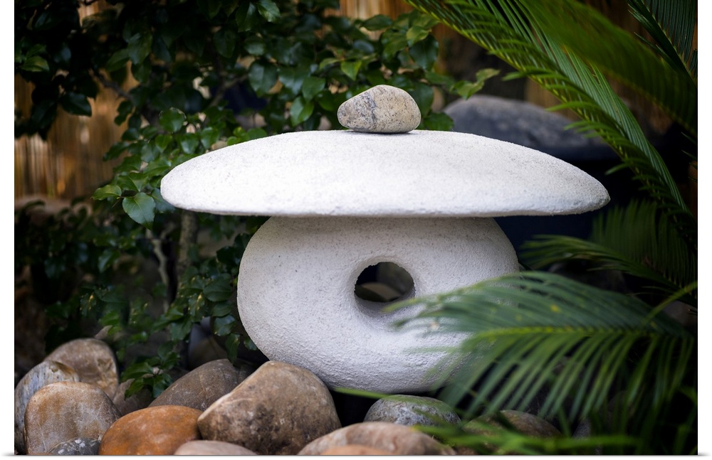 Fine art photo of a zen sculpture made of three carved stones.