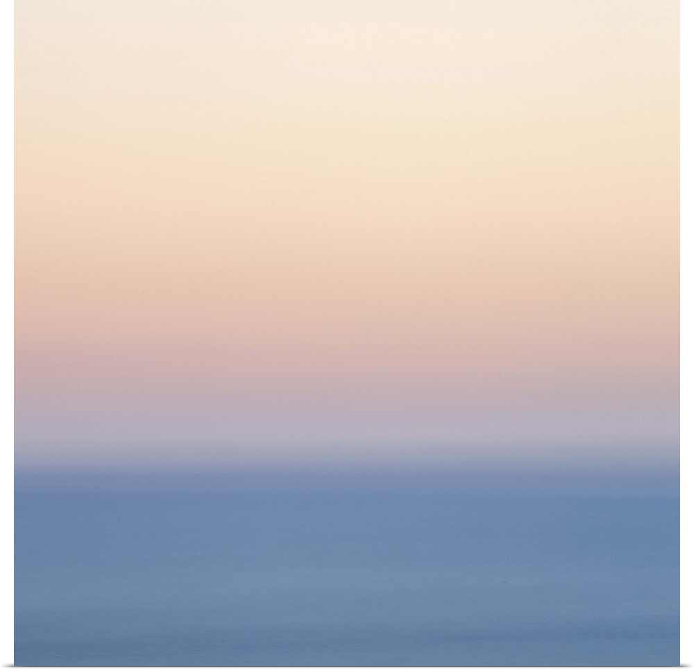 A soft dreamy blurred natural abstract in layers of gentle pastel peach, blue and silvery white laers of colour.