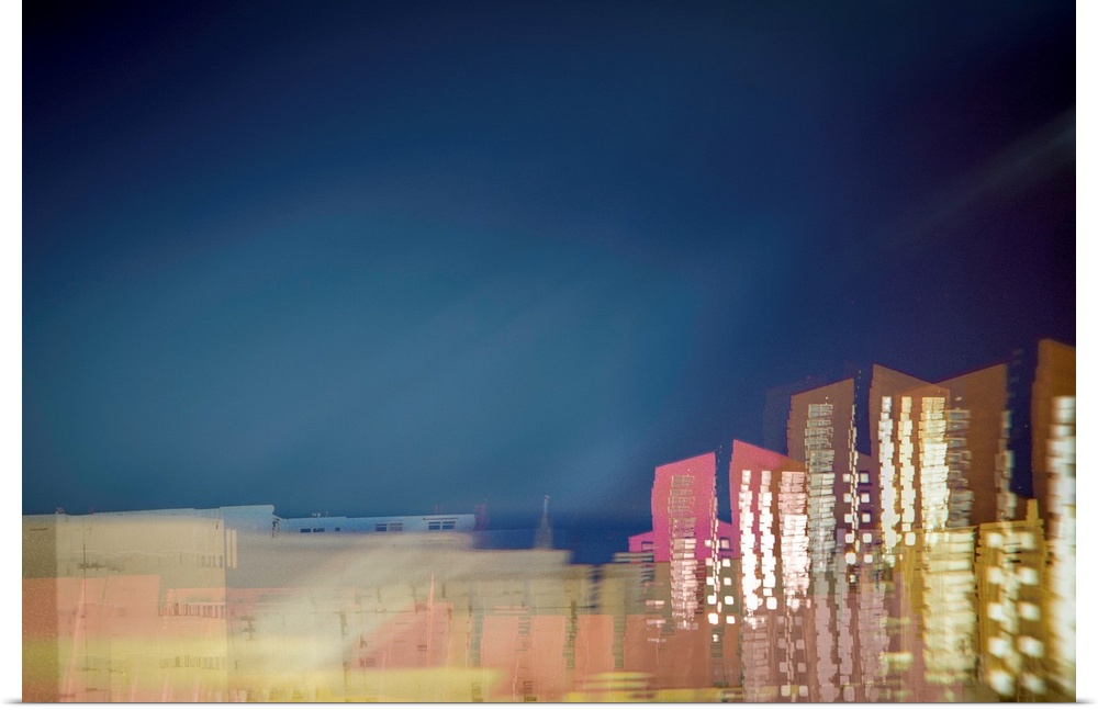 Long exposure photograph of a city skyline with movement and distortion.