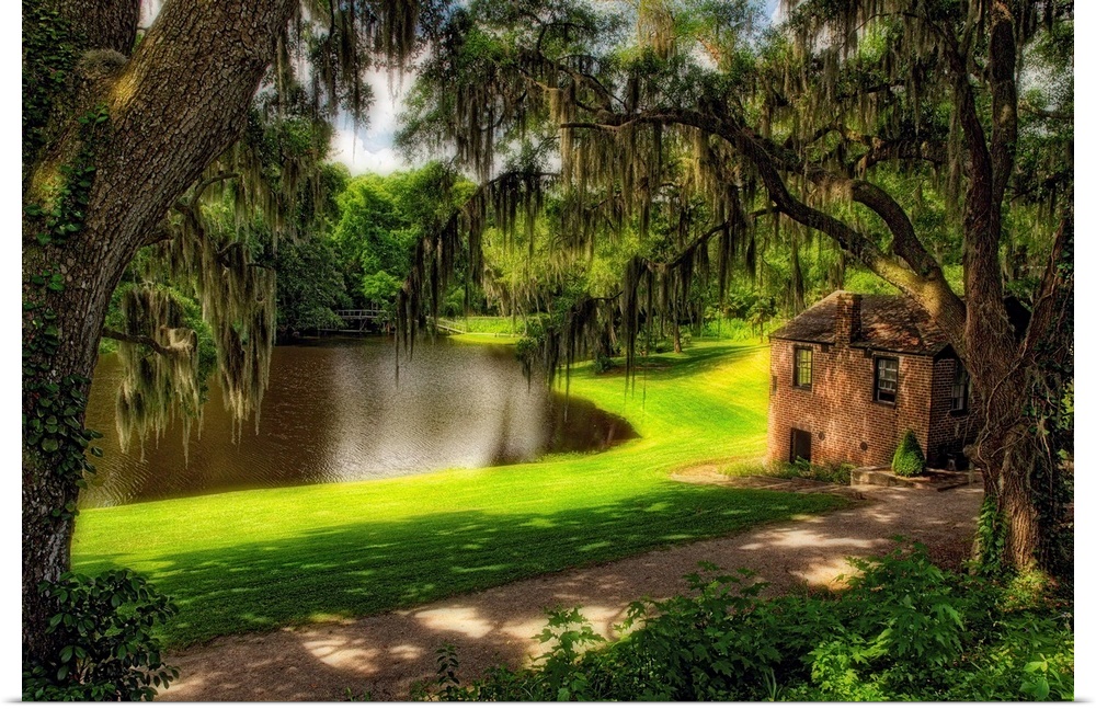 Fine art photo of a small house near a river in a mossy forest in South Carolina.