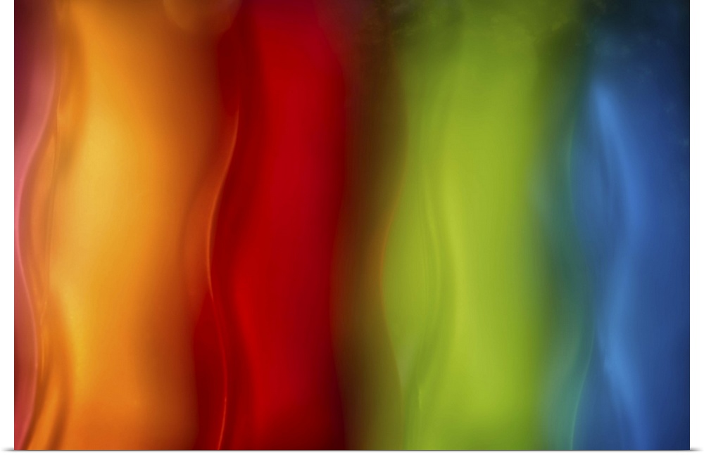 Abstract photograph in orange, red, green, and blue vertical layers.