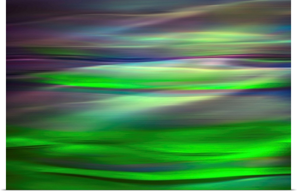 Abstract photograph of a motion blurred landscape of vibrant colors.