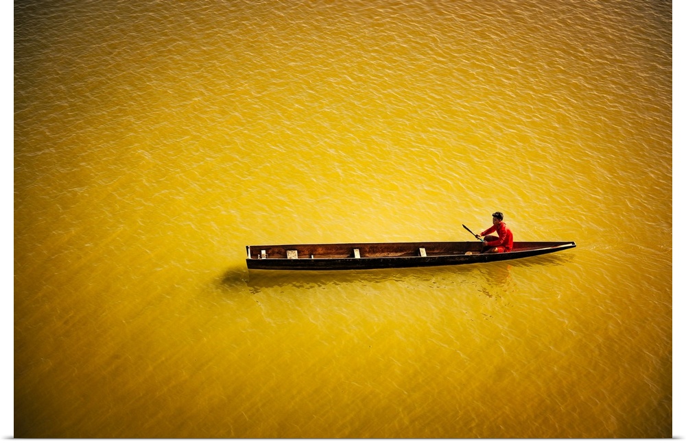 A man in his boat on the Mekong in Laos