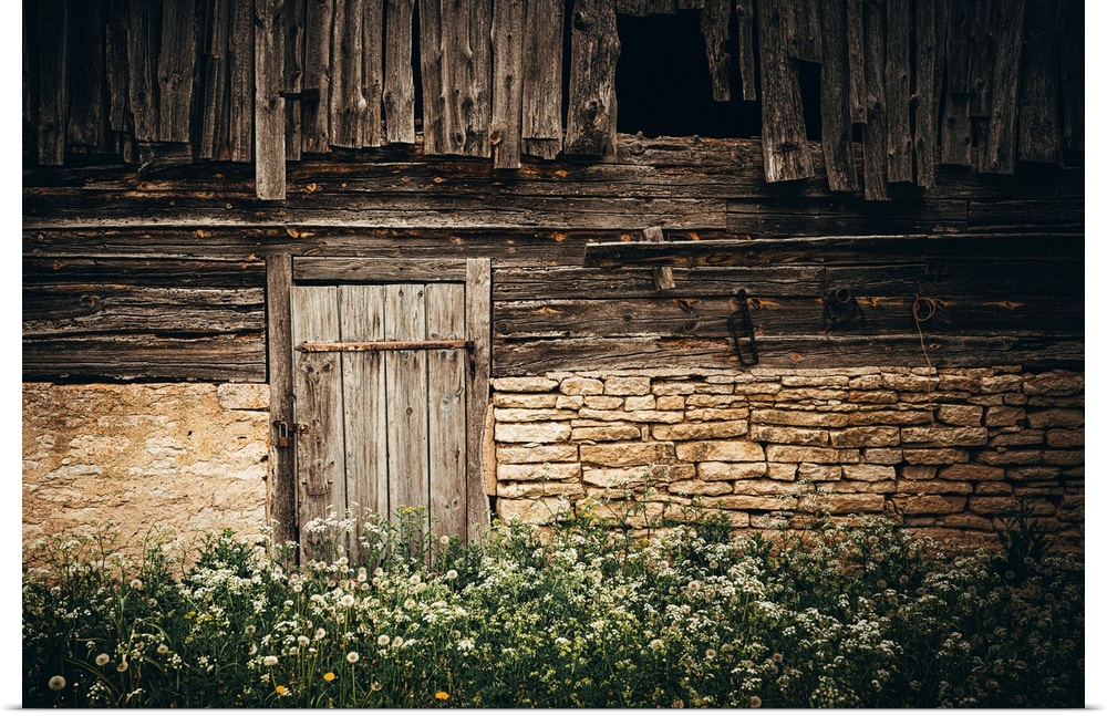 Wooden door of an old stone house