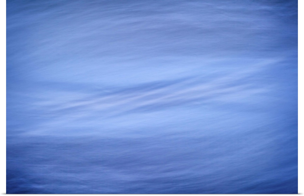 A cool blue contemporary minimal zen-like image of blue and silver swirls.