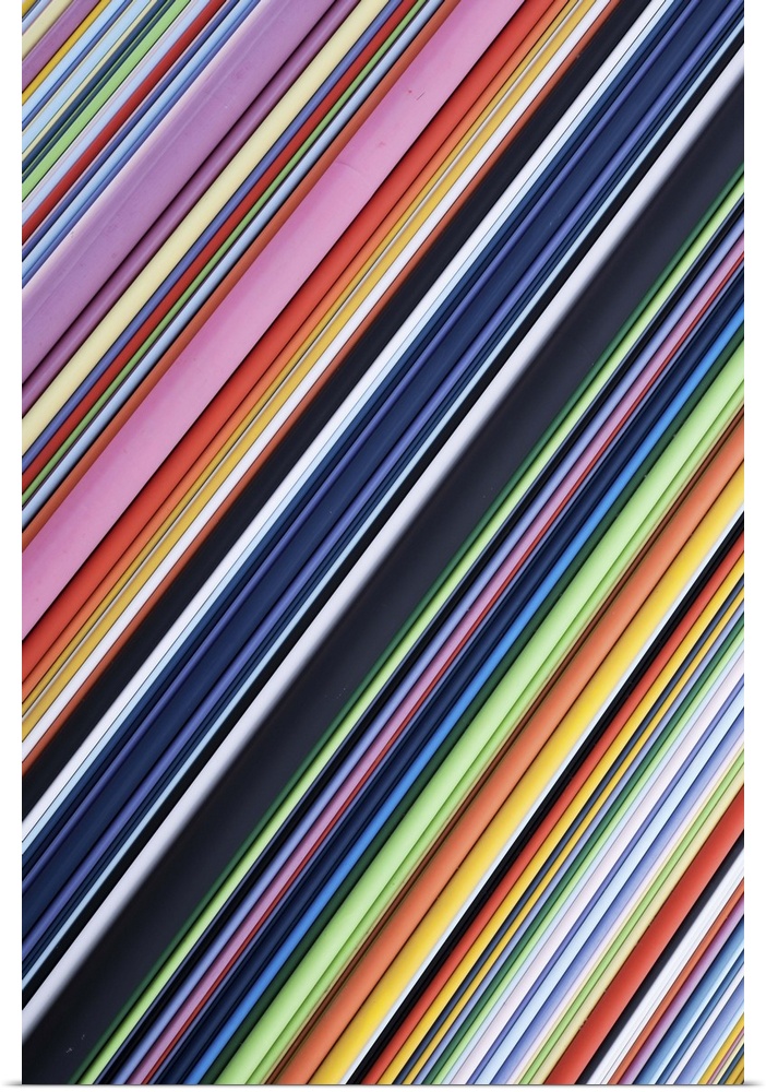 A contemporary energetic rainbow hued abstract with diagonal lines of many shades of colour.