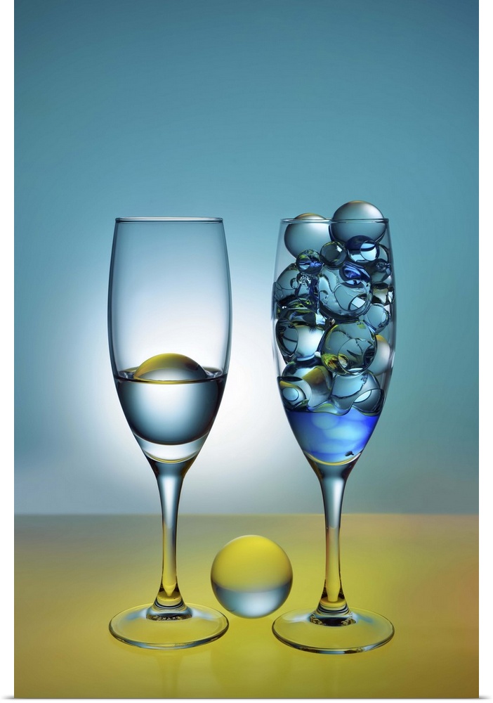 A photograph of glass orbs sitting in tall wine glasses.