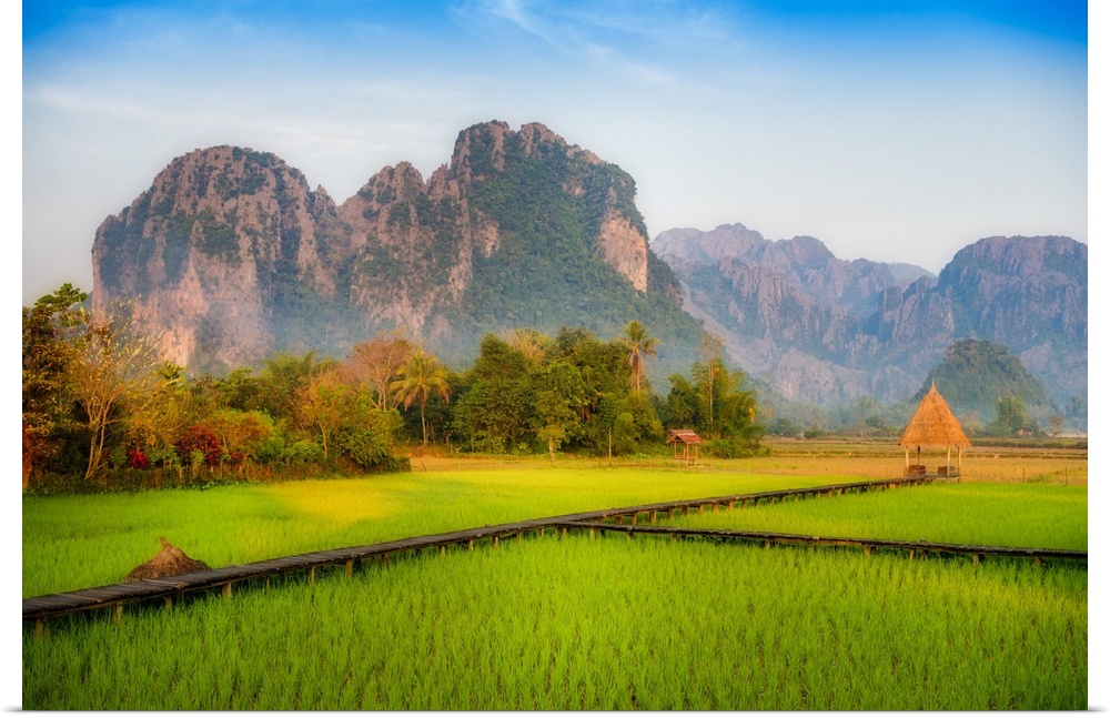 A rice field surrounded by mountains in Laos