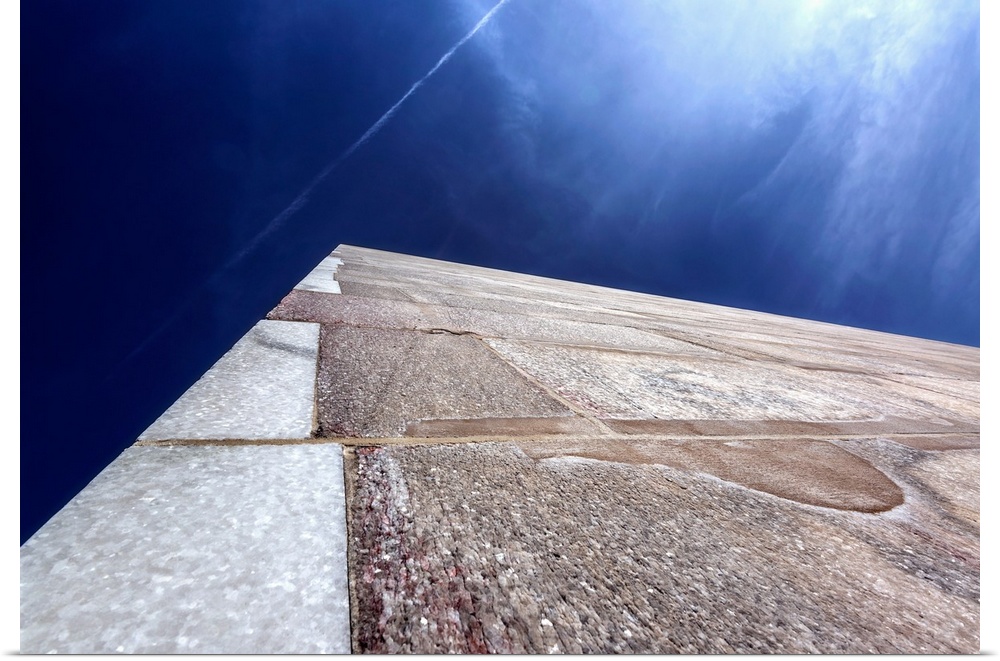 Abstract view of the Washington Monument, looking straight up into the blue sky.