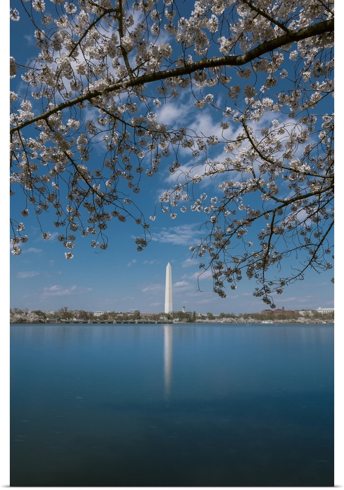Daytime long exposure of Washington Monument and its reflection in Tidal Basin in the spring