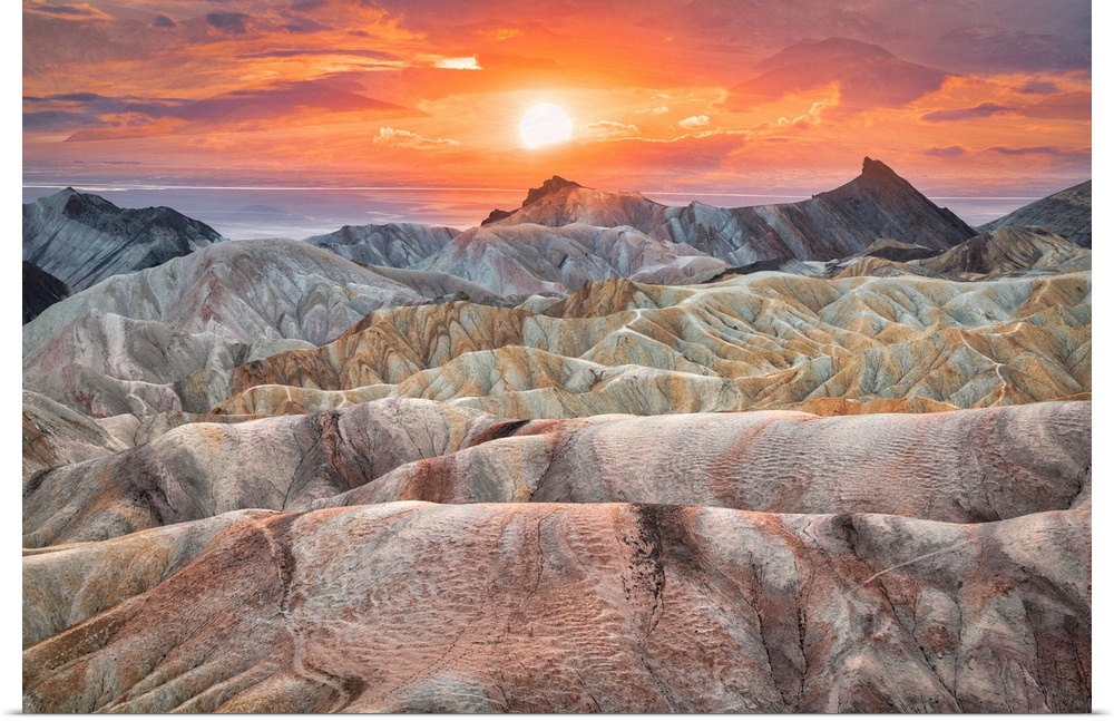 Photograph of the rolling landscape of Zabriskie Point at sunset in Death Valley National Park in California, United States.