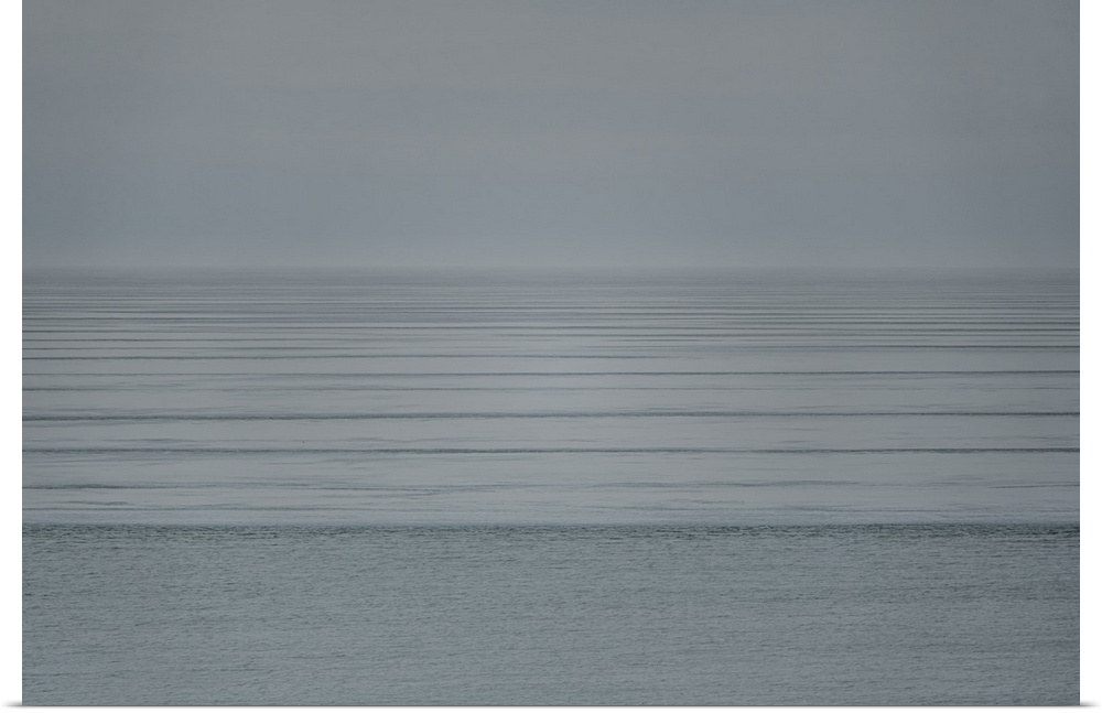 Contemplate mindfulness and peace as you gaze upon this Zen scene of soft ocean ripples fading into the horizon under a mi...