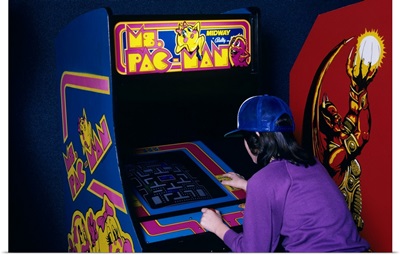 1980's  Teen Girl Playing Ms. Pac Man Video Game In Arcade