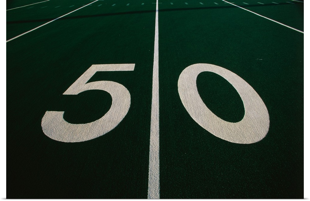 Wall art of the fifty yard line of a football field.