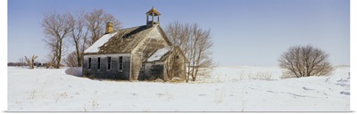 Abandoned schoolhouse on a snow-covered landscape, Friberg Township, Minnesota