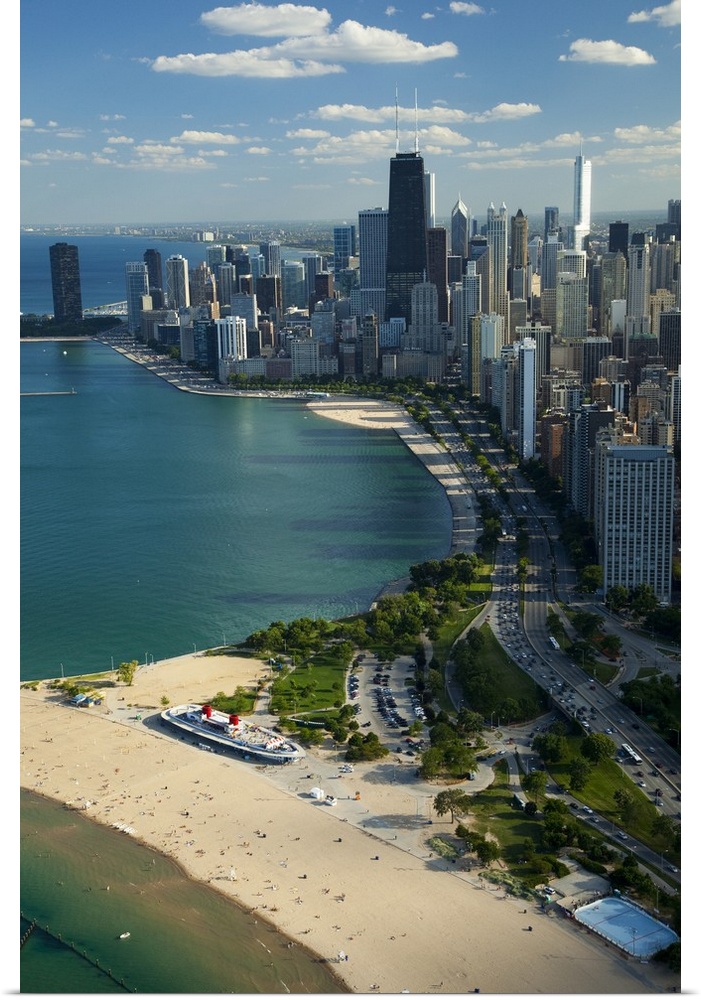 Big vertical aerial view of the city of Chicago in Cook County, Illinois (IL). People relaxing and playing in the blue-gre...