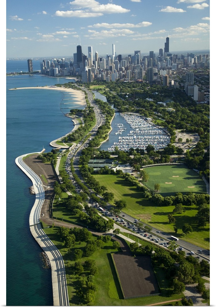 Giant, vertical, aerial photograph of the Lake Michigan shoreline, along Lake Shore Drive in Chicago.  The Chicago skyline...
