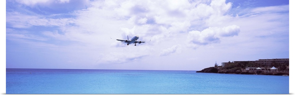 Airplane flying over the sea, Princess Juliana International Airport, Maho Beach, Sint Maarten, Netherlands Antilles