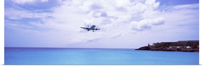 Airplane flying over the sea, Princess Juliana International Airport, Maho Beach, Sint Maarten, Netherlands Antilles