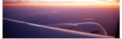 Airplane wing at dusk