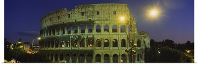 Ancient building lit up at night, Colosseum, Rome, Italy