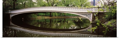 Arch bridge across a lake Central Park Manhattan New York City New York State