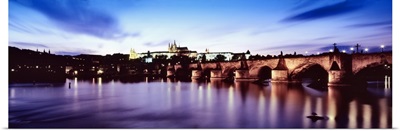 Arch bridge across a river with a cathedral in the background, St. Vitus Cathedral, Hradcany Castle, Vltava river, Prague, Czech Republic