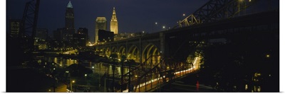 Arch bridge and buildings lit up at night, Cleveland, Ohio