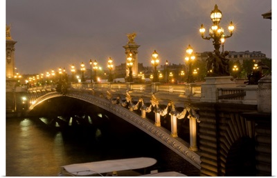 Arch bridge lit up at dusk, Pont Alexandre III, Seine River, Paris, France
