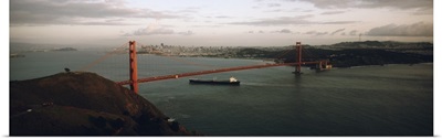 Barge passing under a bridge, Golden Gate Bridge, San Francisco, California