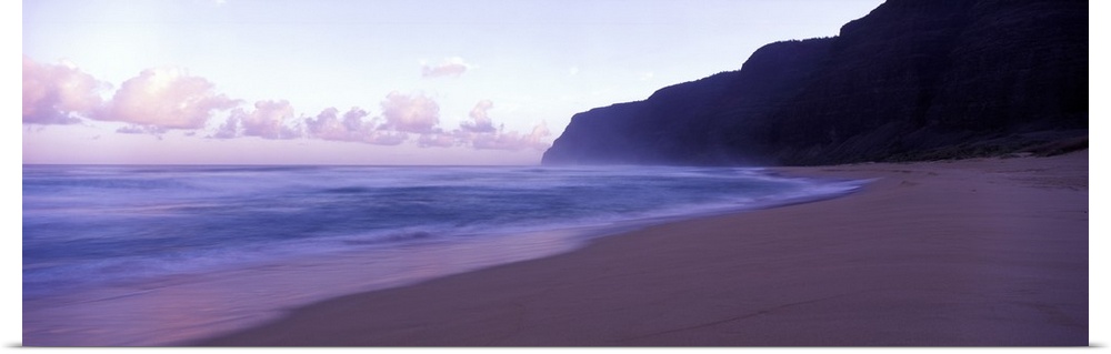Serene panoramic photograph of a Hawaii beach at dusk in soft cooler tones.