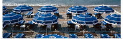 Beach umbrellas on the beach, Nice, Alpes Maritimes, Provence Alpes Cote dAzur, France