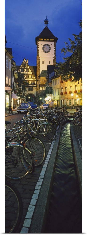 Bicycles parked along a stream near a road, Freiburg, Baden-Wurttemberg, Germany