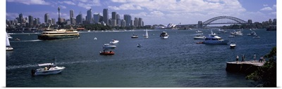 Boats in the sea with a bridge in the background, Sydney Harbor Bridge, Sydney Harbor, Sydney, New South Wales, Australia