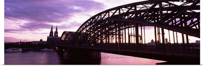 Bridge across a river at dusk, Hohenzollern Bridge, Cologne