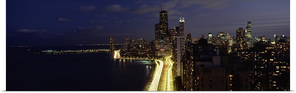 Buildings along a lake lit up at night, Lakeshore Drive, Navy Pier, Lake Michigan, Chicago, Cook County, Illinois,