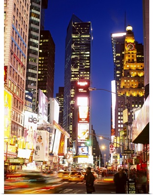 Buildings in a city lit up at dusk, Times Square, Manhattan, New York City, New York State