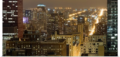 Buildings in a city lit up at night, Chicago South Loop, Chicago, Illinois,