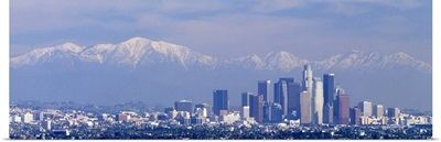 Buildings in a city with snowcapped mountains in the background, San Gabriel Mountains, City of Los Angeles, California