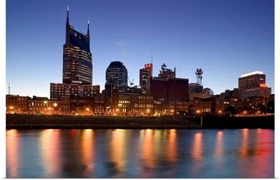 Buildings lit up at dusk at the waterfront, Cumberland River, Bell South Tower, Nashville, Tennessee