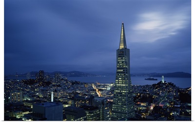 Buildings lit up at dusk, Transamerica Pyramid, Coit Tower, San Francisco, California,